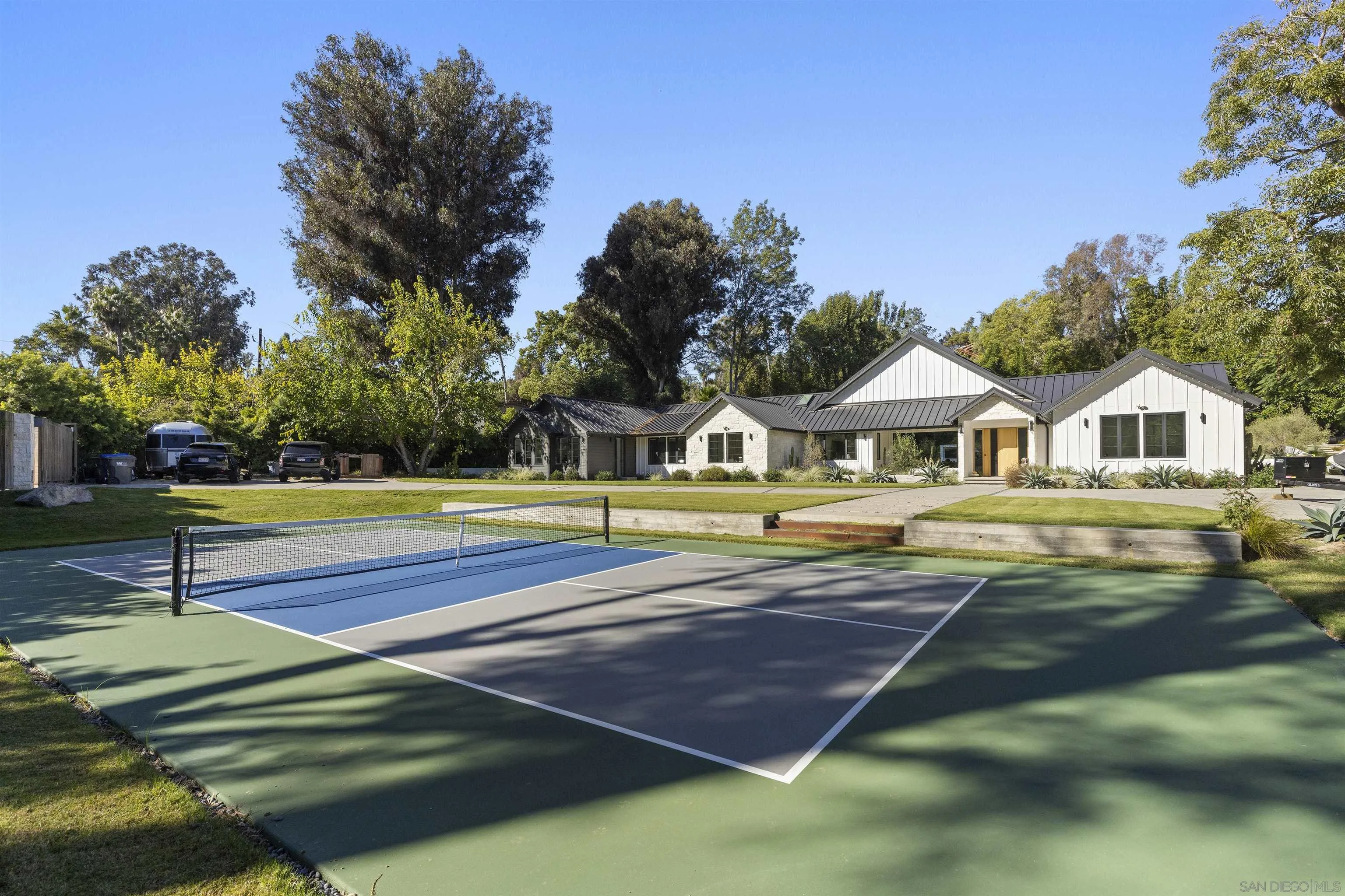 4874 Sun Valley Road Del Mar, CA 92014 - Photo 3 of 42 a view of an house with swimming pool and yard