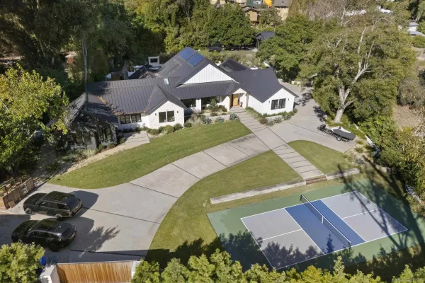 an aerial view of a house with a garden