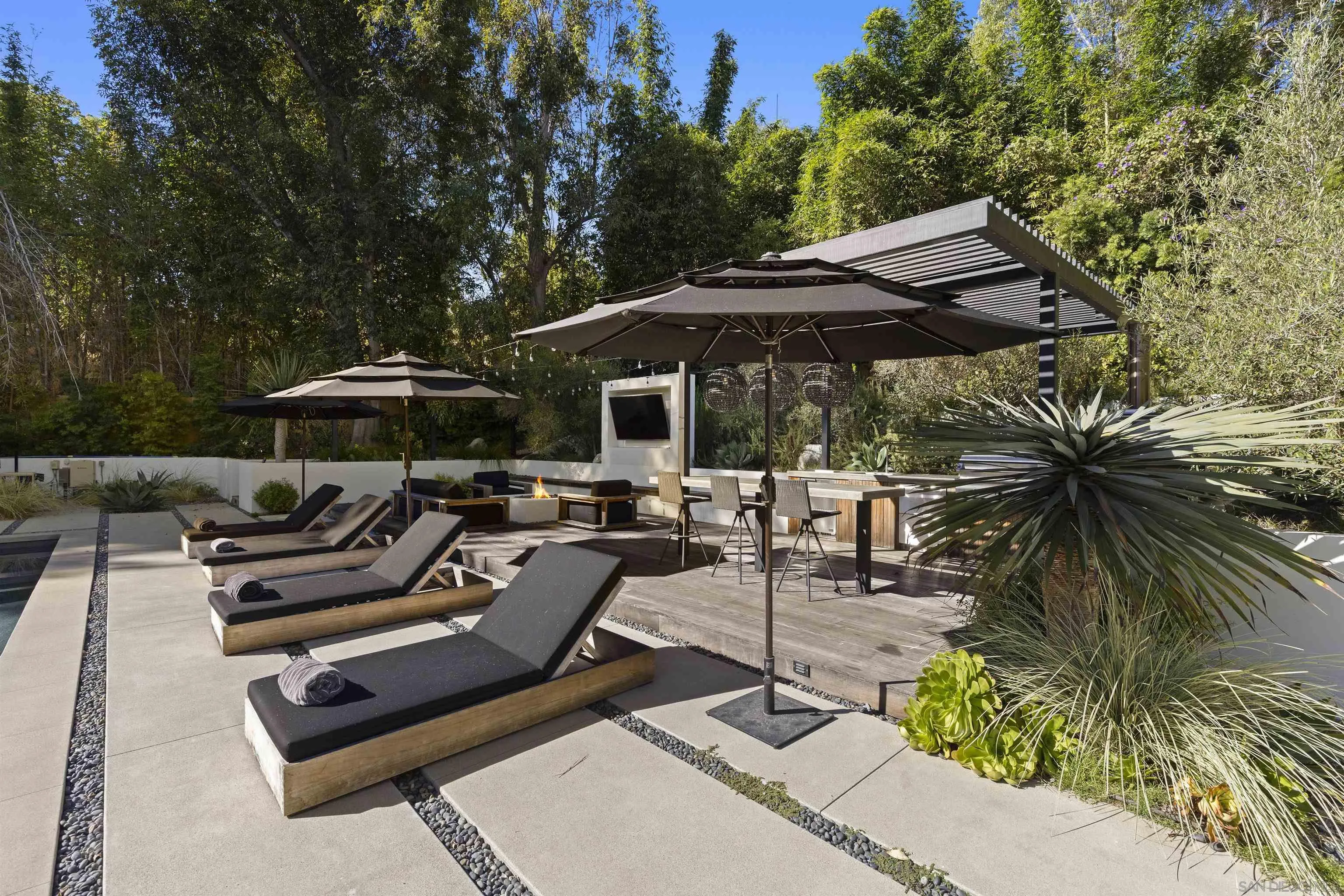 4874 Sun Valley Road Del Mar, CA 92014 - Photo 31 of 42 a view of backyard with outdoor seating and trees