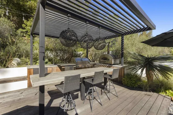 a view of balcony with wooden floor and outdoor seating
