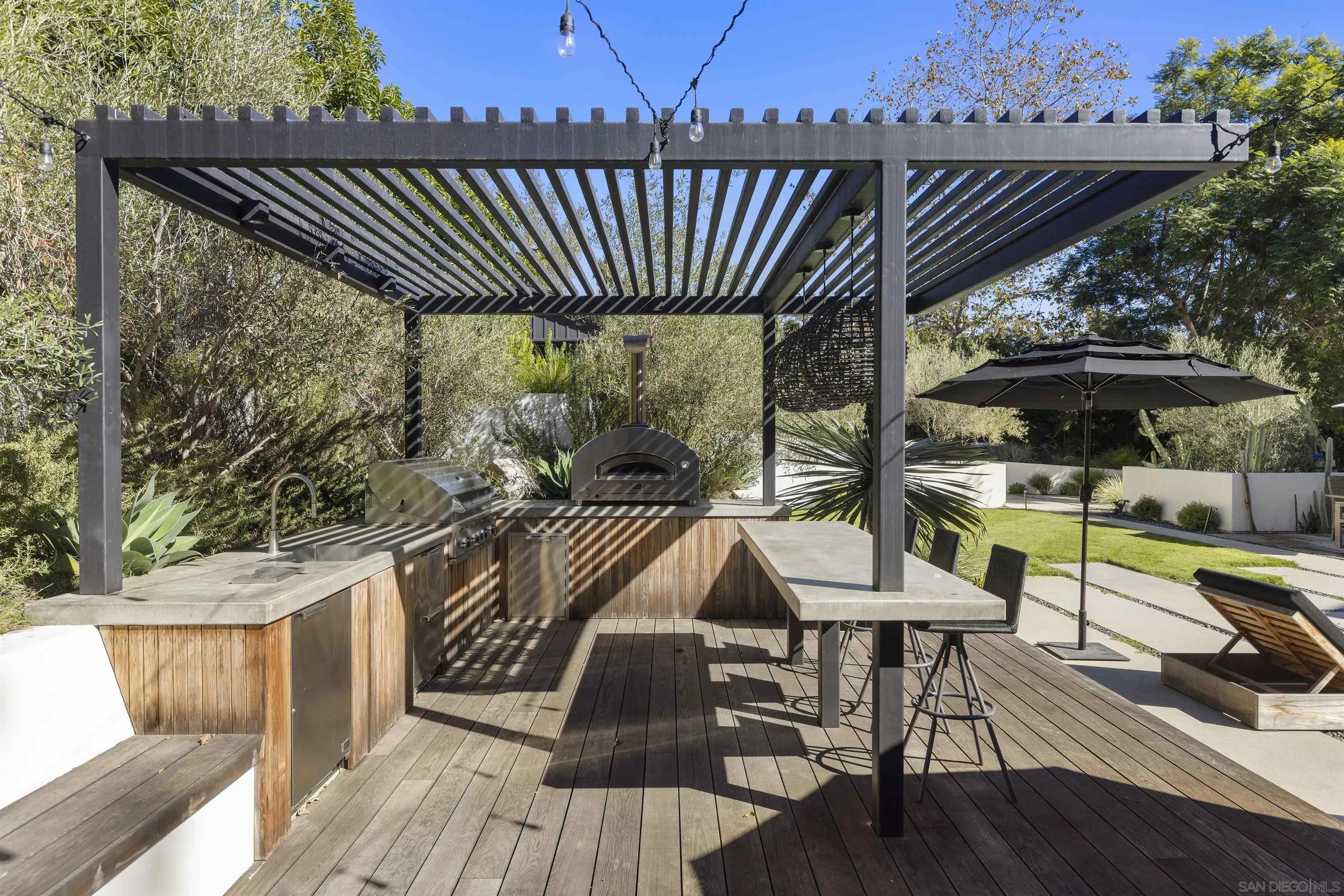 4874 Sun Valley Road Del Mar, CA 92014 - Photo 35 of 42 a view of balcony with wooden floor and outdoor seating