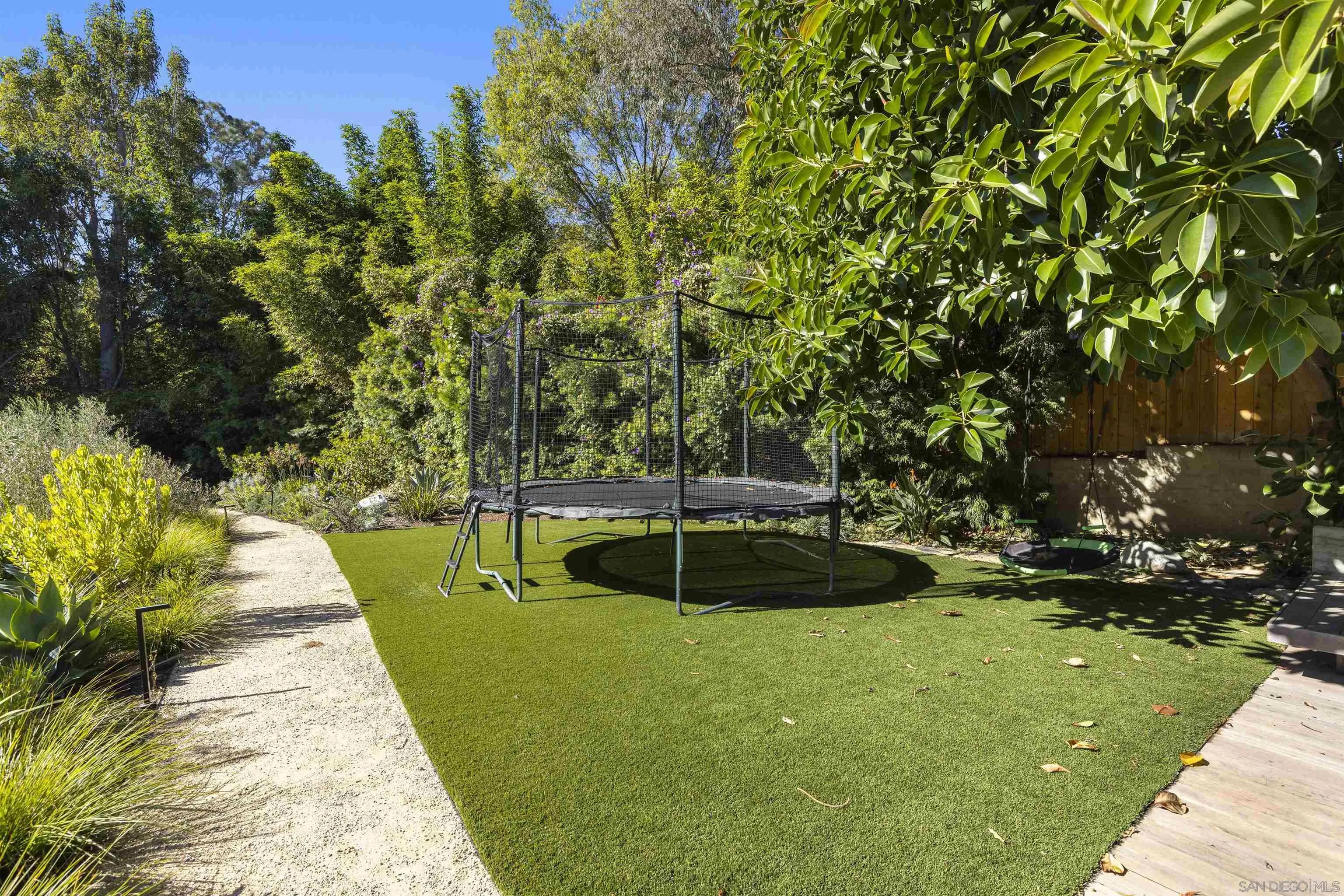 4874 Sun Valley Road Del Mar, CA 92014 - Photo 40 of 42 a view of a swimming pool with a patio