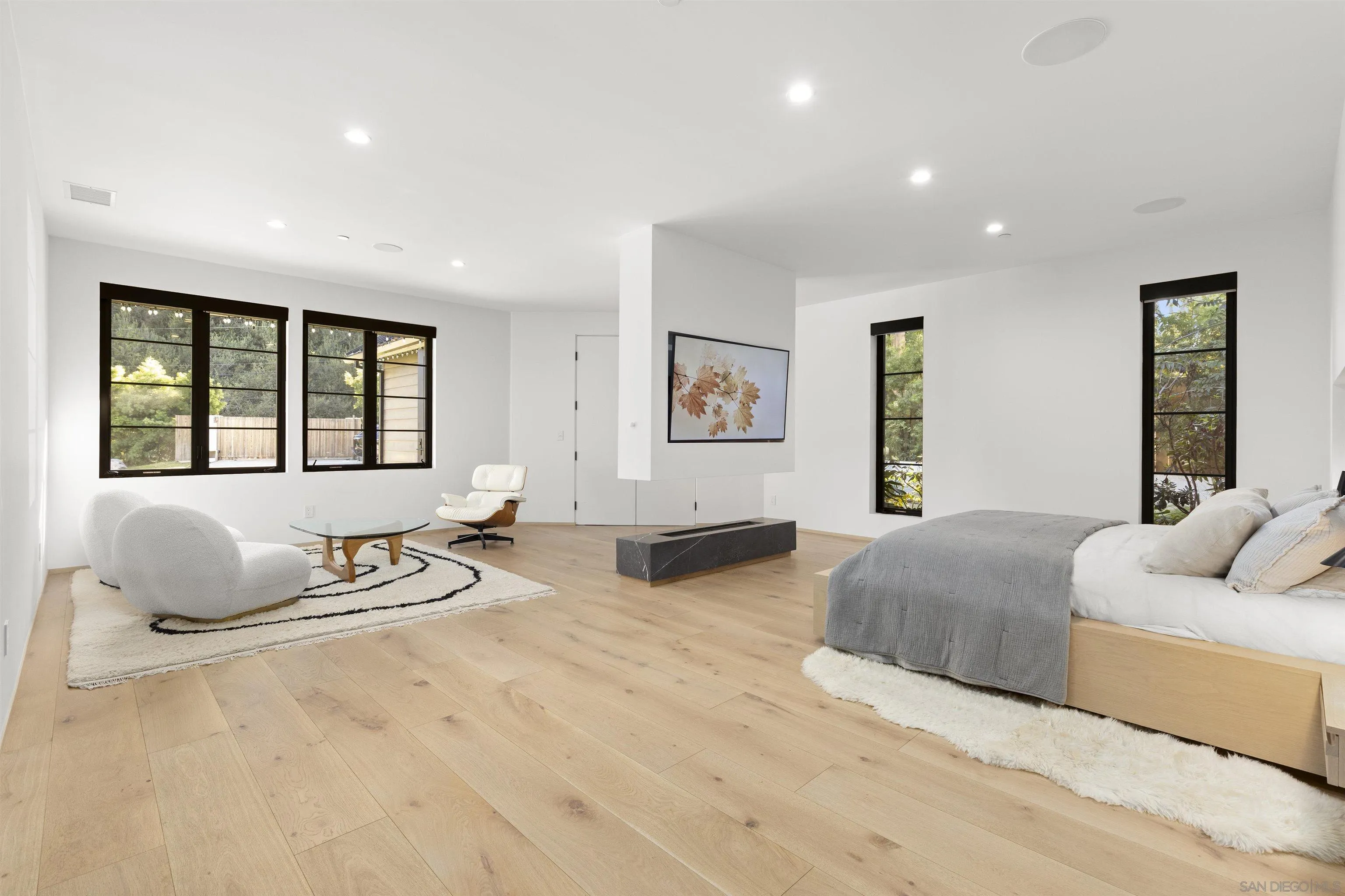 4874 Sun Valley Road Del Mar, CA 92014 - Photo 7 of 42 a bedroom with a bed and glass window