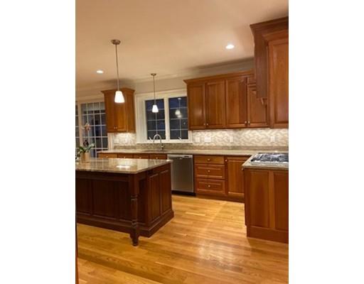375 Hillcrest Road Needham, MA 02492 - Photo 11 of 32 a kitchen with stainless steel appliances granite countertop a sink and a stove