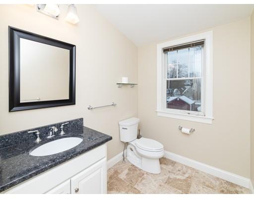 375 Hillcrest Road Needham, MA 02492 - Photo 27 of 32 a bathroom with a granite countertop sink and a mirror
