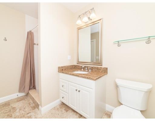 375 Hillcrest Road Needham, MA 02492 - Photo 29 of 32 a bathroom with a granite countertop sink and a mirror
