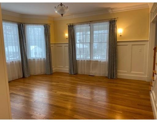 375 Hillcrest Road Needham, MA 02492 - Photo 6 of 32 a view of an empty room with window and wooden floor