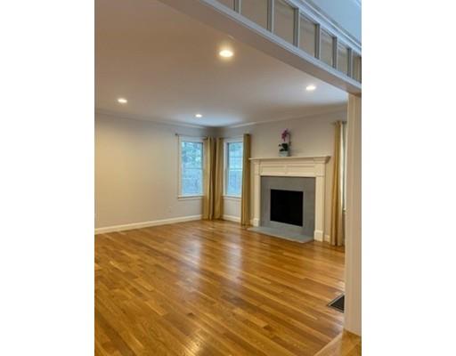 375 Hillcrest Road Needham, MA 02492 - Photo 8 of 32 a view of an empty room with a fireplace