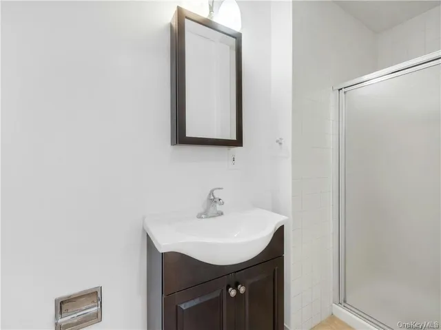 a bathroom with a sink a mirror and a vanity