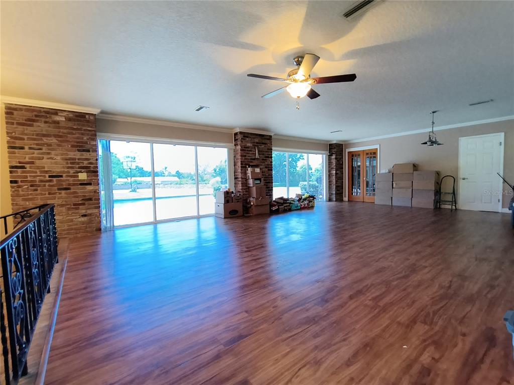 910 North Kepler Road DeLand, FL 32724 - Photo 12 of 52 wooden floor in an empty room with a window