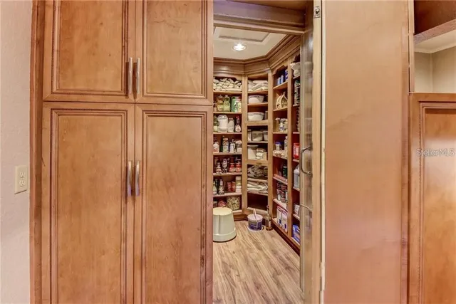 a utility room with wooden floor washer and dryer