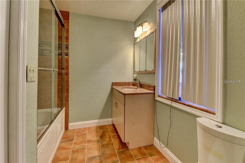 910 North Kepler Road DeLand, FL 32724 - Photo 20 of 52 view of room with window and hallway