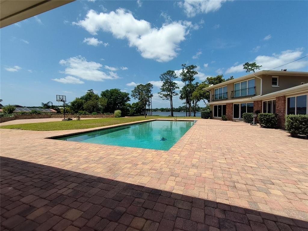 910 North Kepler Road DeLand, FL 32724 - Photo 25 of 52 a view of swimming pool is middle in the garden