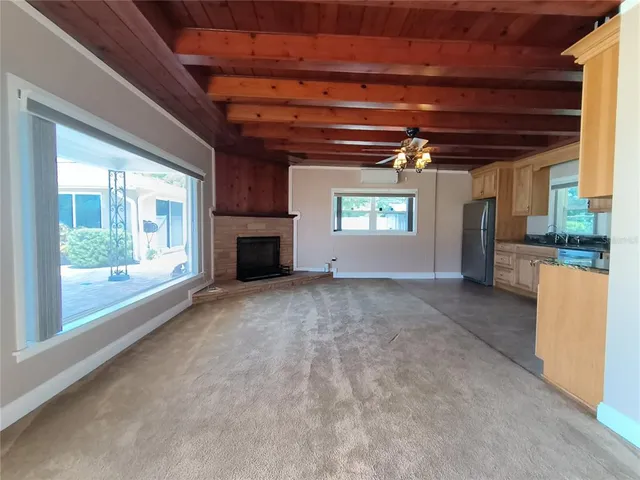 a kitchen with granite countertop a sink stainless steel appliances and cabinets