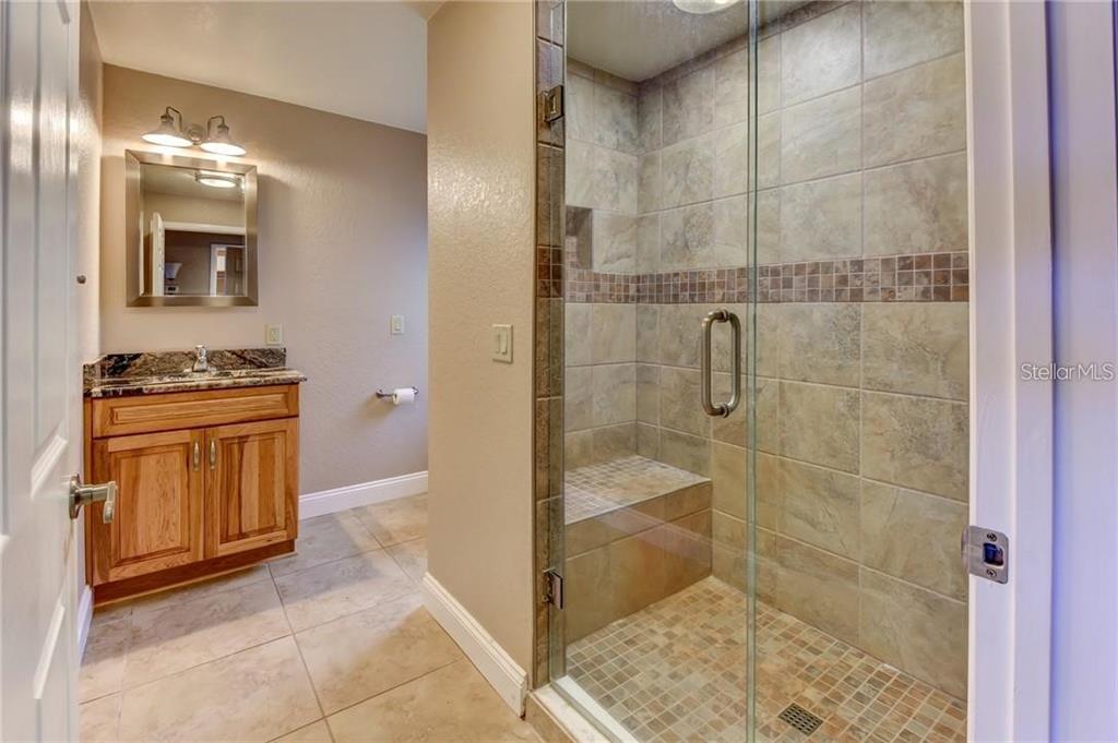 910 North Kepler Road DeLand, FL 32724 - Photo 35 of 52 a bathroom with a shower and a sink