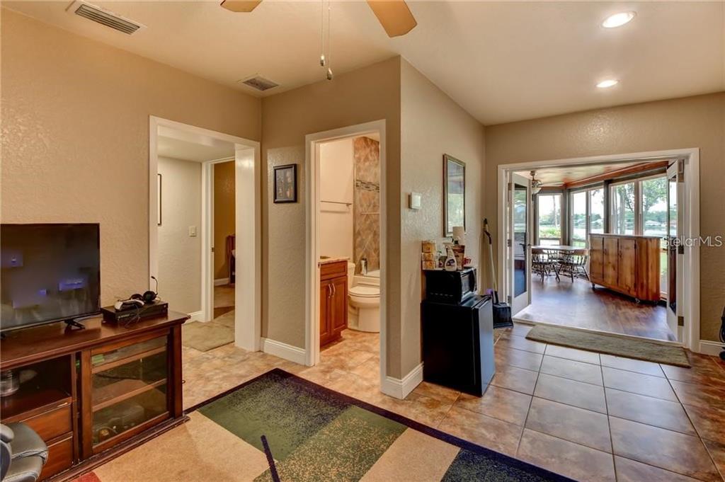 910 North Kepler Road DeLand, FL 32724 - Photo 37 of 52 a living room with furniture and a flat screen tv