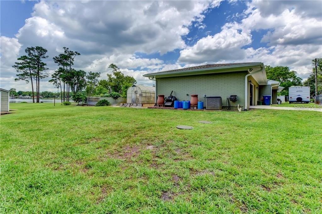 910 North Kepler Road DeLand, FL 32724 - Photo 40 of 52 a view of a yard with a house