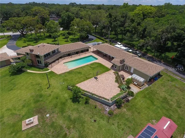 an aerial view of a house with a garden