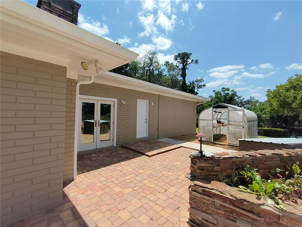 910 North Kepler Road DeLand, FL 32724 - Photo 41 of 52 a front view of a house with a yard and garage