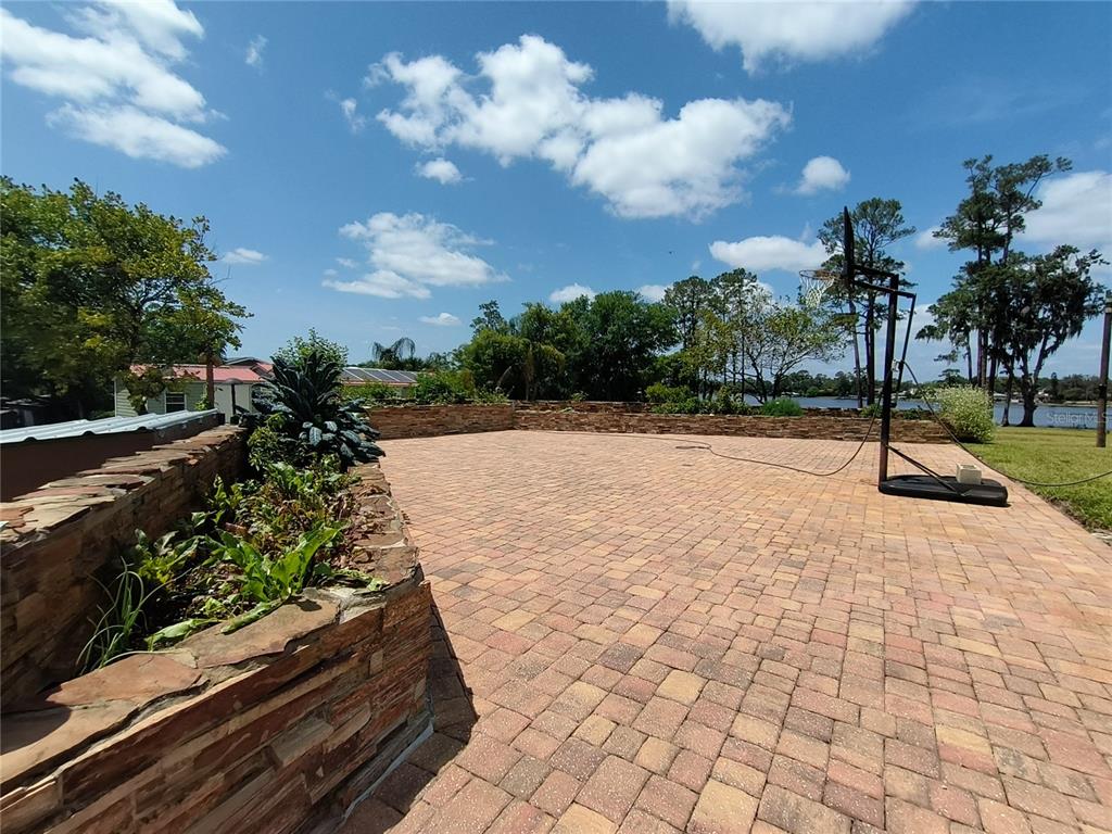 910 North Kepler Road DeLand, FL 32724 - Photo 42 of 52 a view of a pathway with a yard