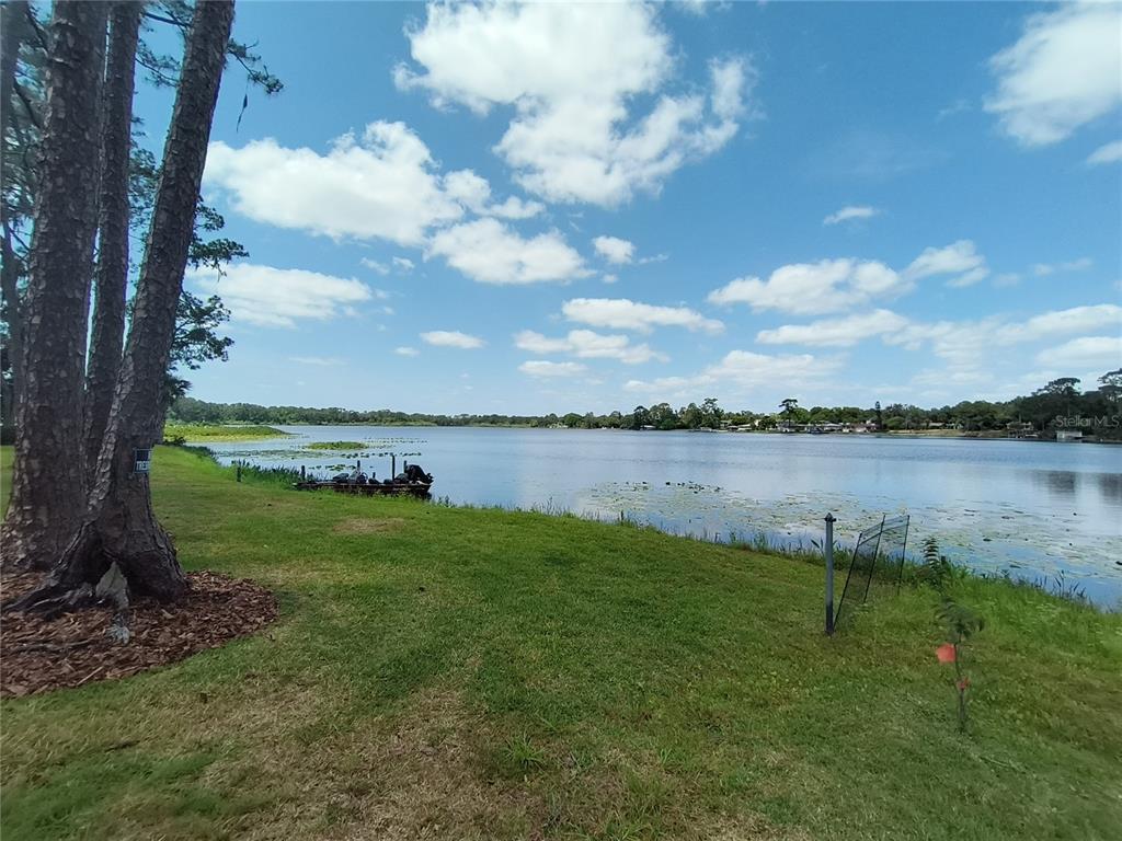 910 North Kepler Road DeLand, FL 32724 - Photo 46 of 52 a view of a lake from a yard