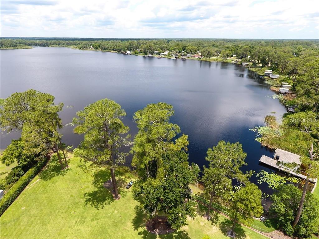 910 North Kepler Road DeLand, FL 32724 - Photo 49 of 52 a view of a lake with a lake
