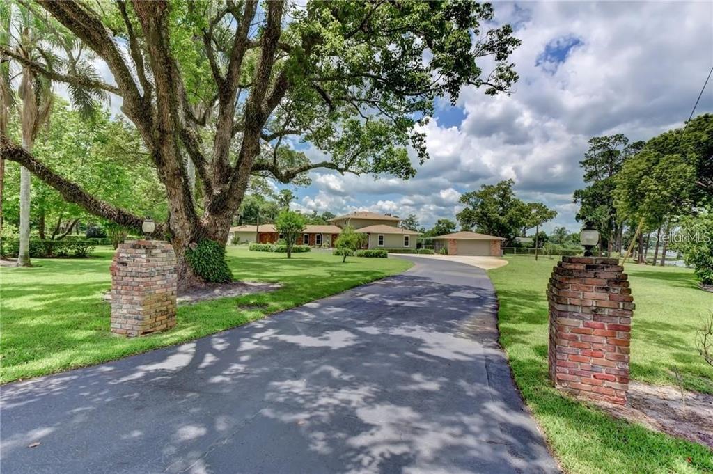 910 North Kepler Road DeLand, FL 32724 - Photo 5 of 52 a view of a park with large trees