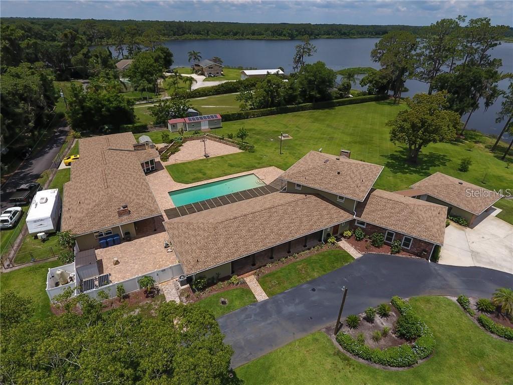 910 North Kepler Road DeLand, FL 32724 - Photo 52 of 52 an aerial view of a house with garden space and street view