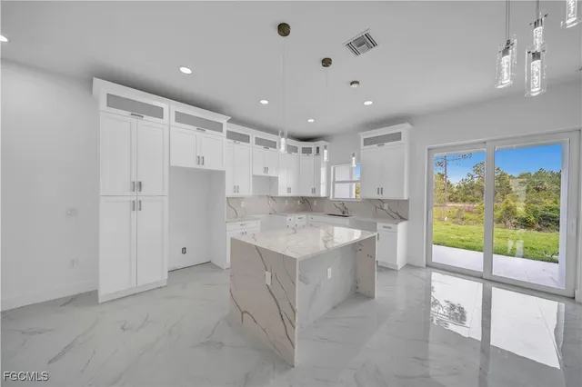 a large kitchen with a large window