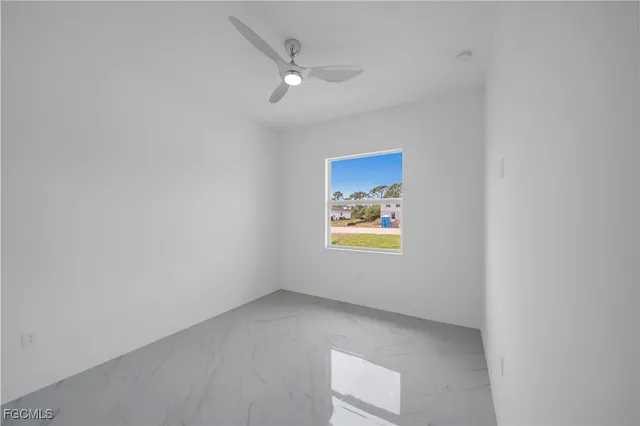 a view of an empty room and a window