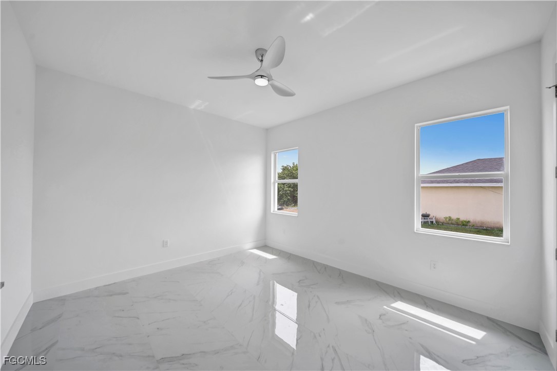 1153 Countess Avenue Lehigh Acres, FL 33974 - Photo 30 of 37 a view of an empty room with a window