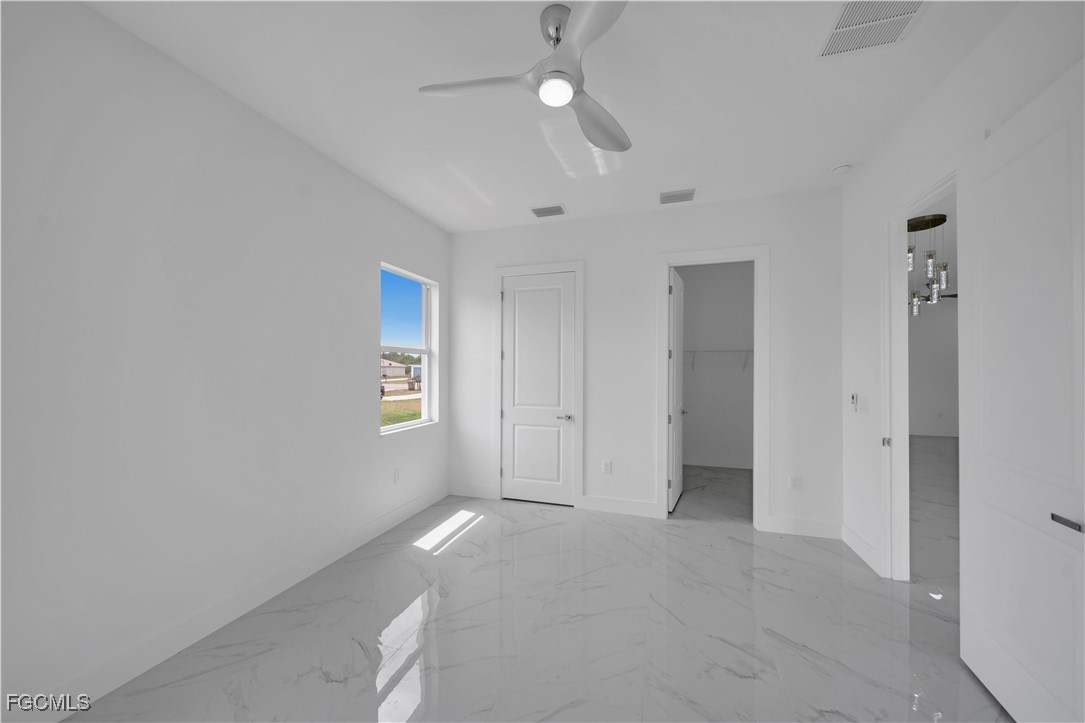 1153 Countess Avenue Lehigh Acres, FL 33974 - Photo 31 of 37 a view of an empty room with a window