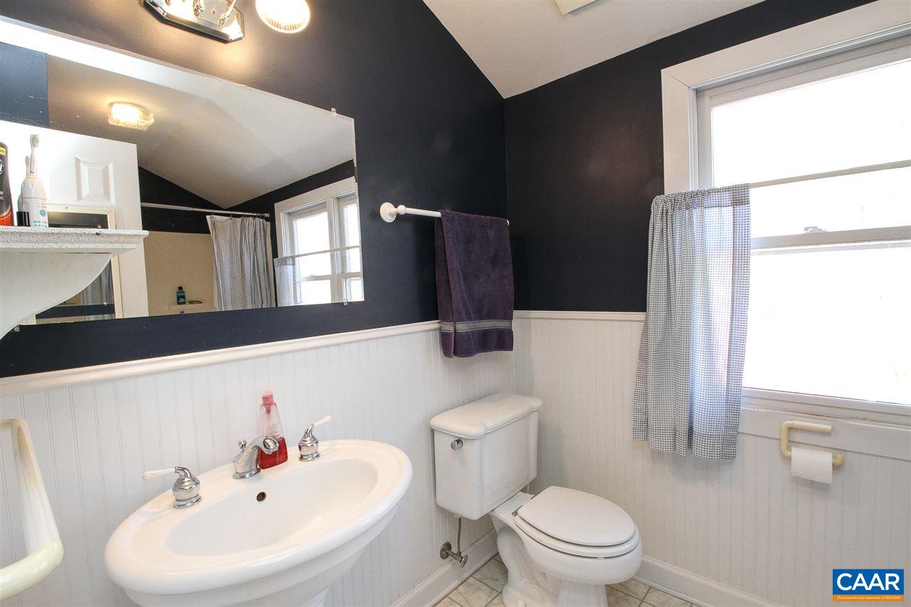 364 Lake Road Troy, VA 22974 - Photo 20 of 25 a bathroom with a sink a toilet and a mirror