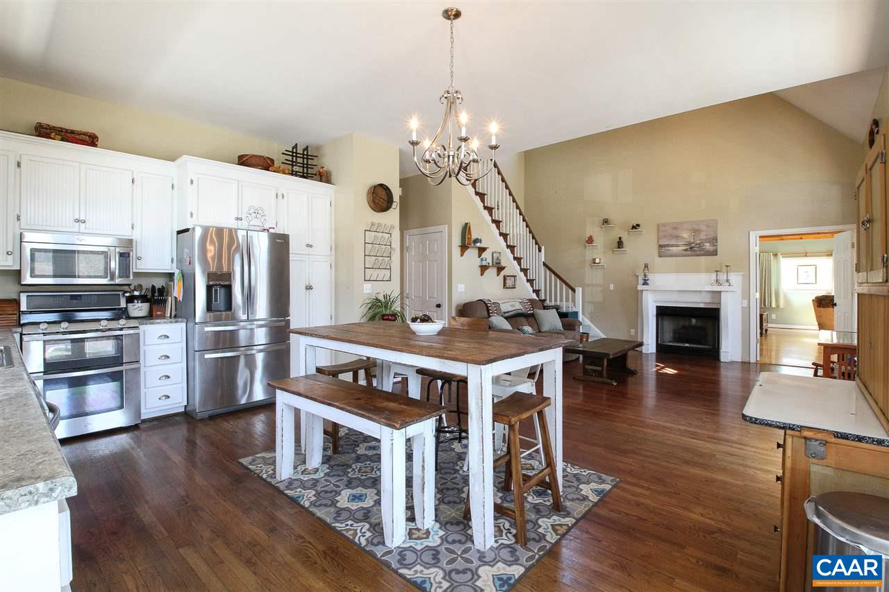 364 Lake Road Troy, VA 22974 - Photo 3 of 25 a open kitchen with stainless steel appliances granite countertop a stove refrigerator and a fireplace