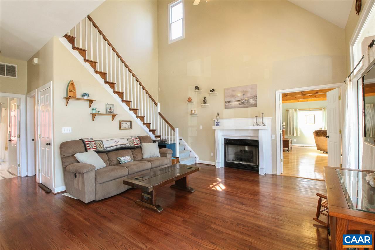 364 Lake Road Troy, VA 22974 - Photo 6 of 25 a living room with fireplace furniture and a wooden floor