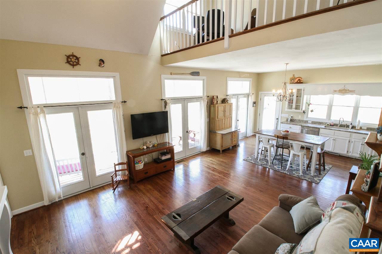 364 Lake Road Troy, VA 22974 - Photo 9 of 25 a living room with furniture wooden floor and a flat screen tv