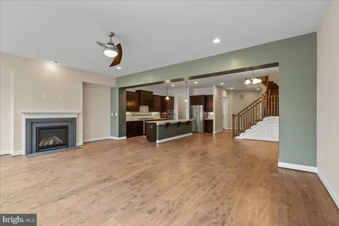 a view of a livingroom with a fireplace and cabinets