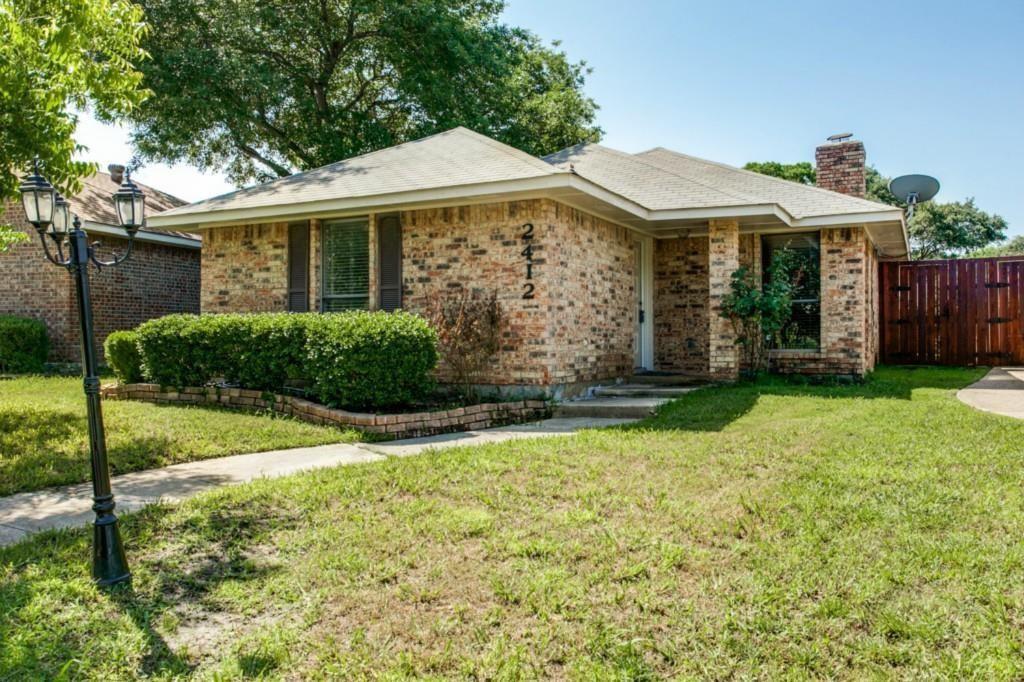 2412 Ridgestone Drive Dallas, TX 75287 - Photo 1 of 23 a front view of a house with garden