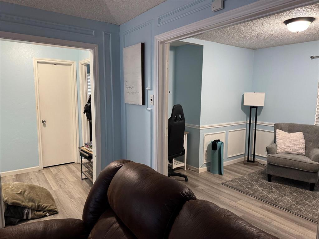 2412 Ridgestone Drive Dallas, TX 75287 - Photo 6 of 23 a living room with furniture and a couch