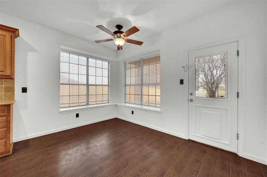 8105 Eagle Drive Rowlett, TX 75088 - Photo 13 of 35 a view of empty room with wooden floor and fan