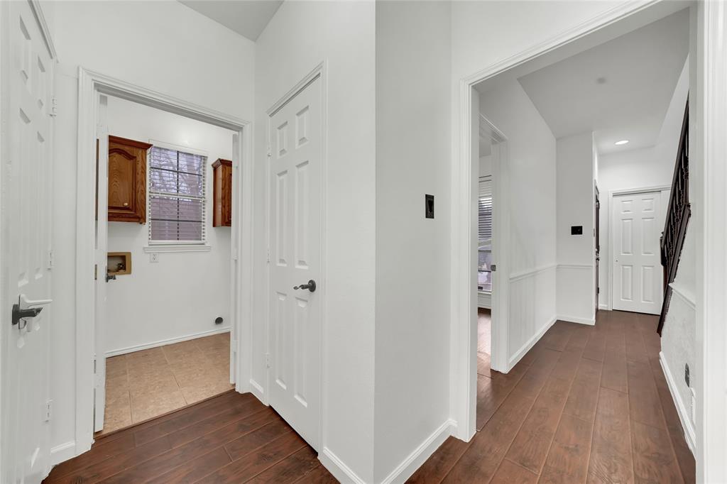 8105 Eagle Drive Rowlett, TX 75088 - Photo 15 of 35 a view of an empty room with wooden floor and a bathroom