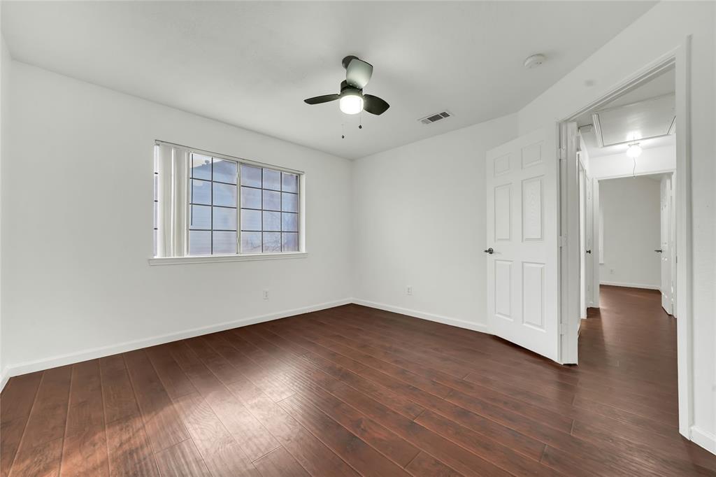 8105 Eagle Drive Rowlett, TX 75088 - Photo 24 of 35 a view of an empty room with wooden floor and a window