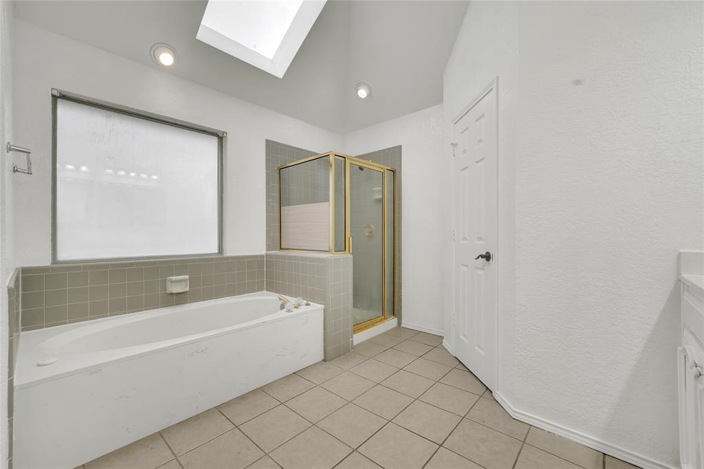 8105 Eagle Drive Rowlett, TX 75088 - Photo 27 of 35 a bathroom with a bathtub and a shower