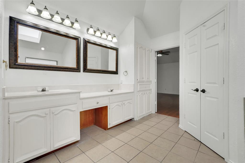 8105 Eagle Drive Rowlett, TX 75088 - Photo 28 of 35 a spacious bathroom with a double vanity sink mirror and