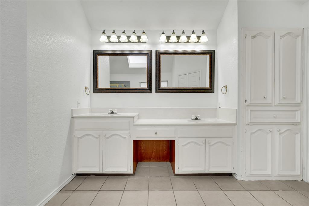 8105 Eagle Drive Rowlett, TX 75088 - Photo 29 of 35 a bathroom with a sink vanity and mirror