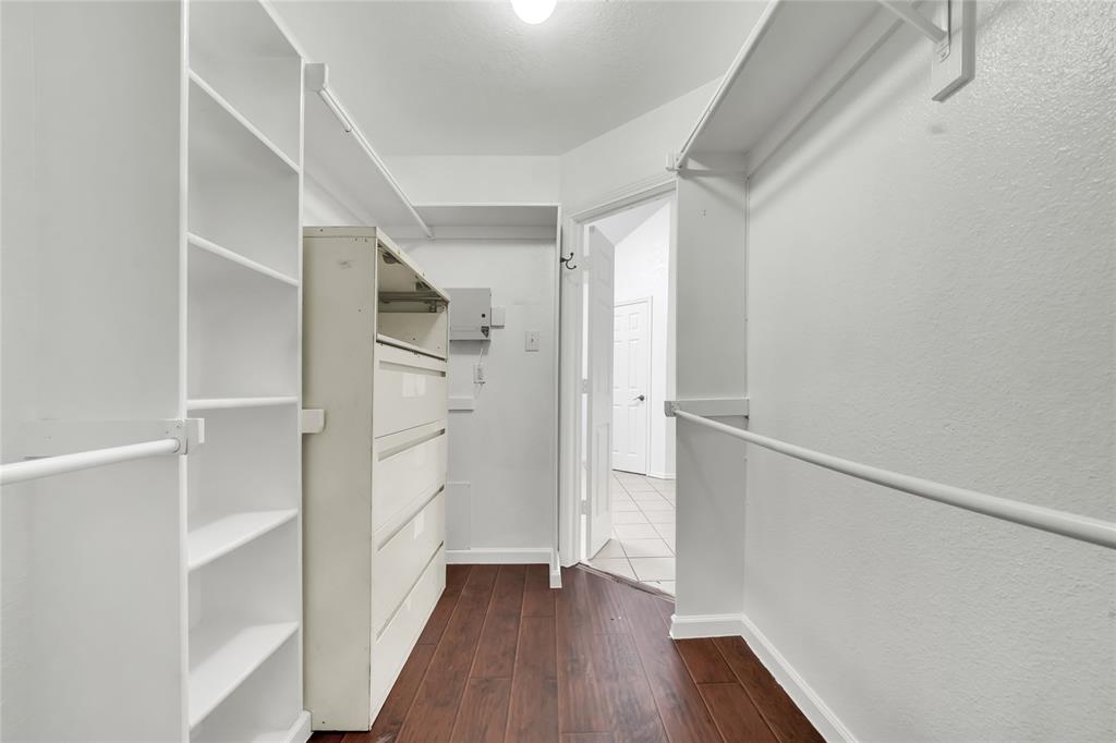 8105 Eagle Drive Rowlett, TX 75088 - Photo 30 of 35 a view of walk in closet with wooden floor