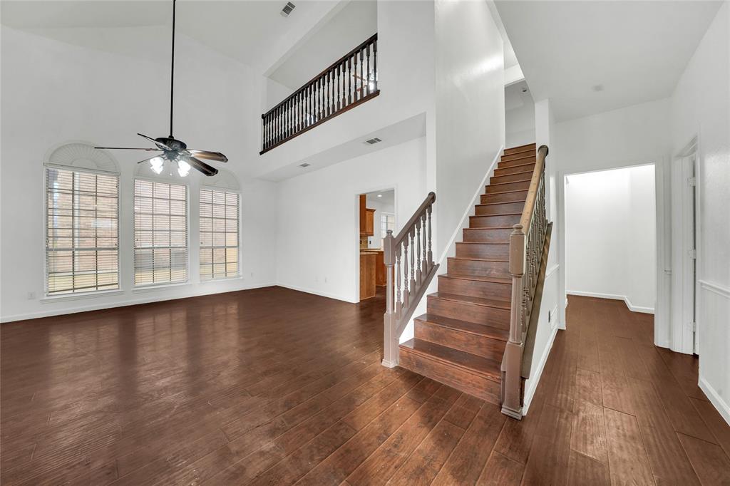 8105 Eagle Drive Rowlett, TX 75088 - Photo 5 of 35 a view of a livingroom with wooden floor and stairs