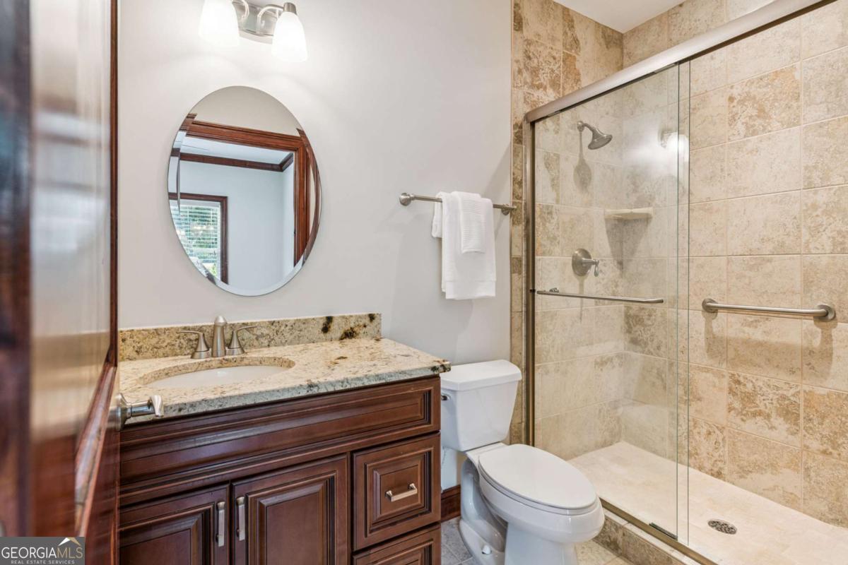 150 Rice Mill St. Simons Island, GA 31522 - Photo 24 of 38 a bathroom with a sink toilet and shower