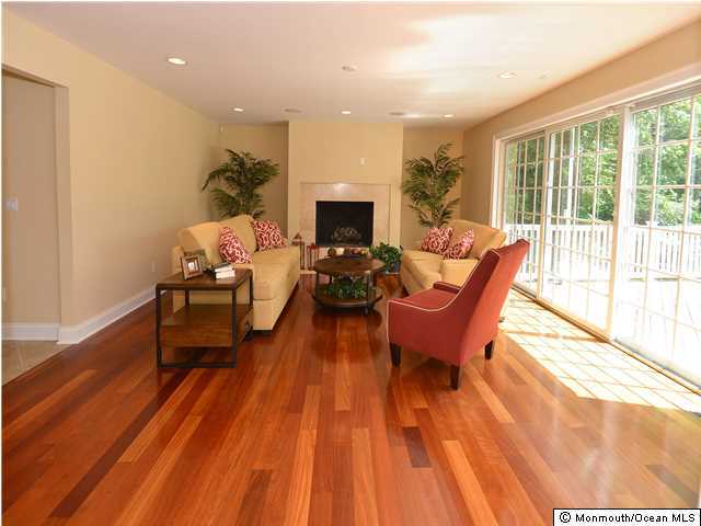 1813 Celeste Drive Wall, NJ 07719 - Photo 11 of 22 a living room with furniture and a fireplace