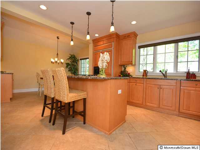 1813 Celeste Drive Wall, NJ 07719 - Photo 3 of 22 a large kitchen with a table and chairs